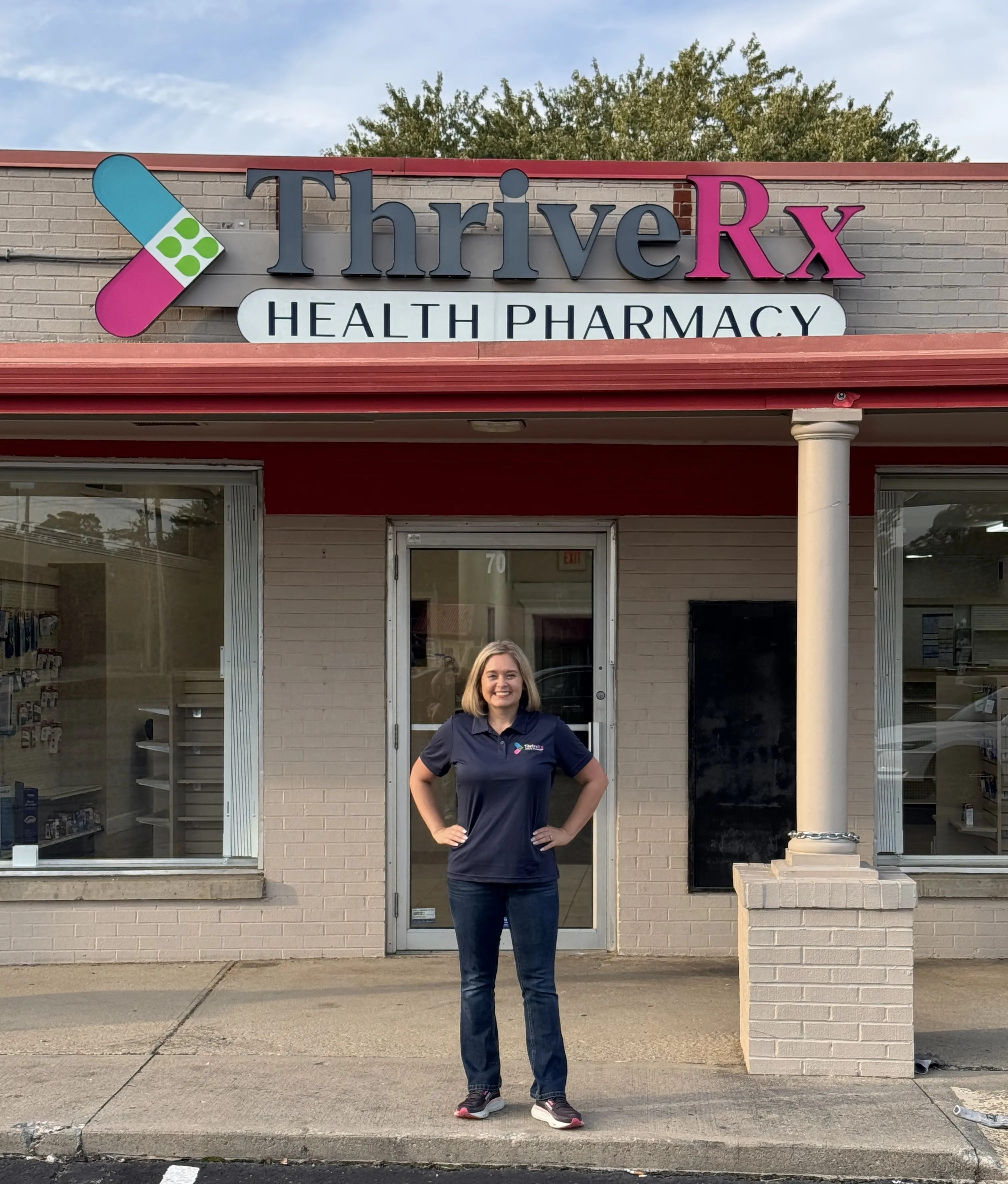 Larecia Seibert at the pharmacy counter in warm daylight