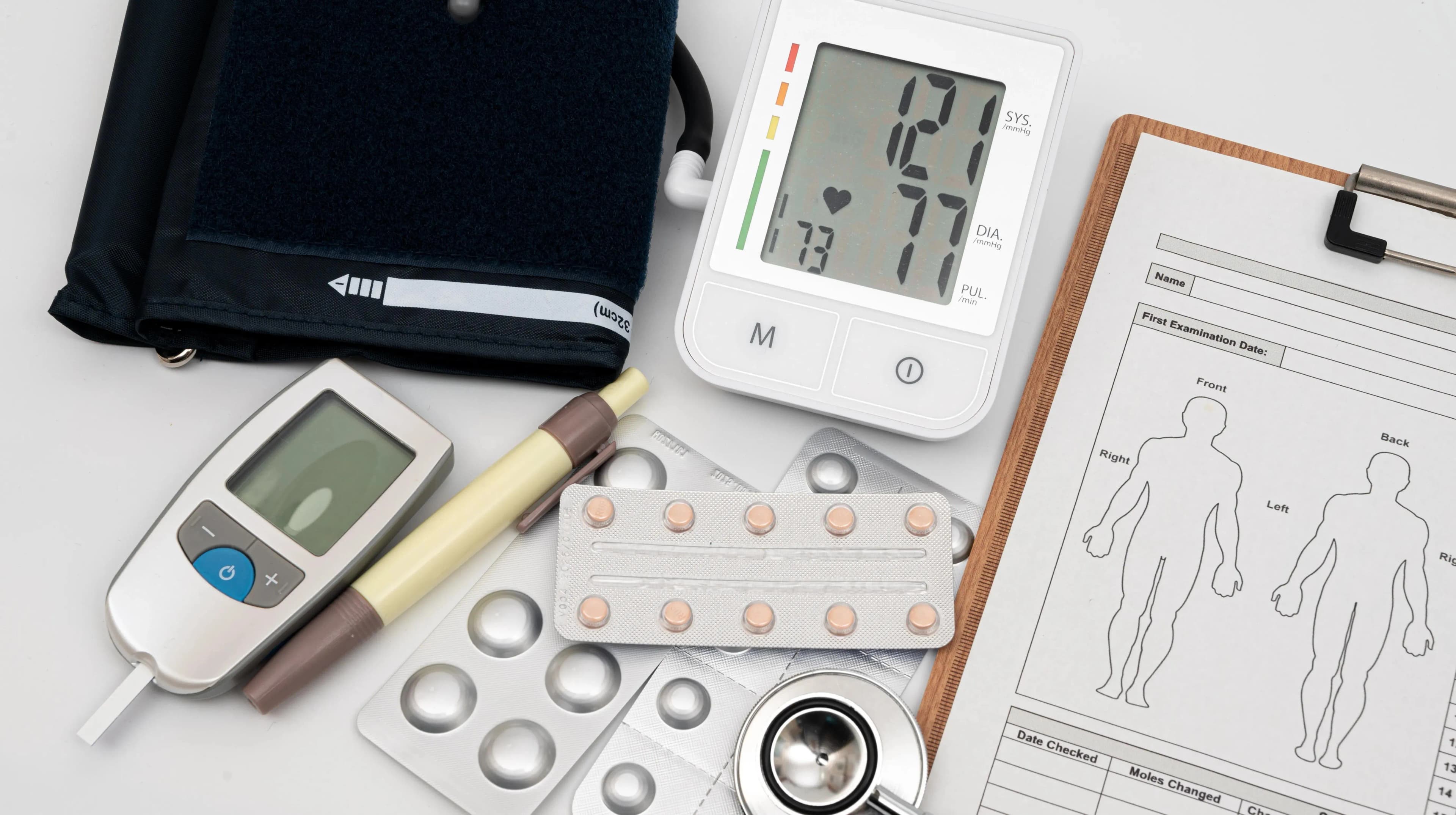 Screening in the consult room, blood pressure cuff and InBody scale