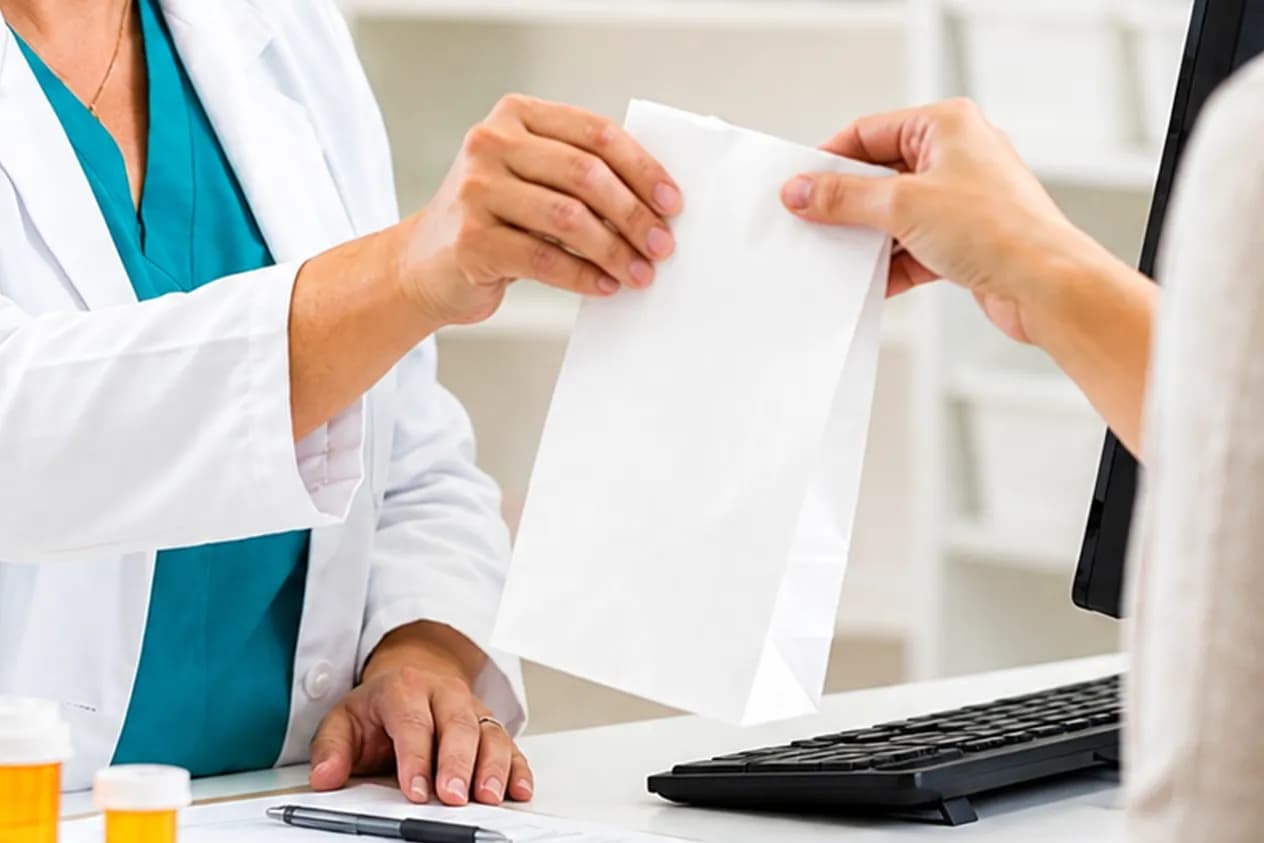 Larecia Seibert, PharmD, reviewing a lab report with a patient